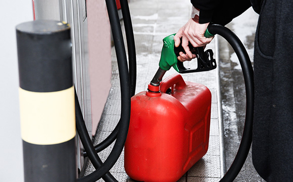 Filling a portable gas can at a gas station