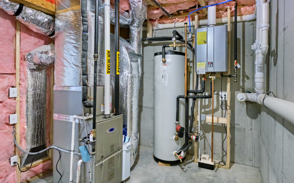 Photo of a utility room with a furnace and water heater